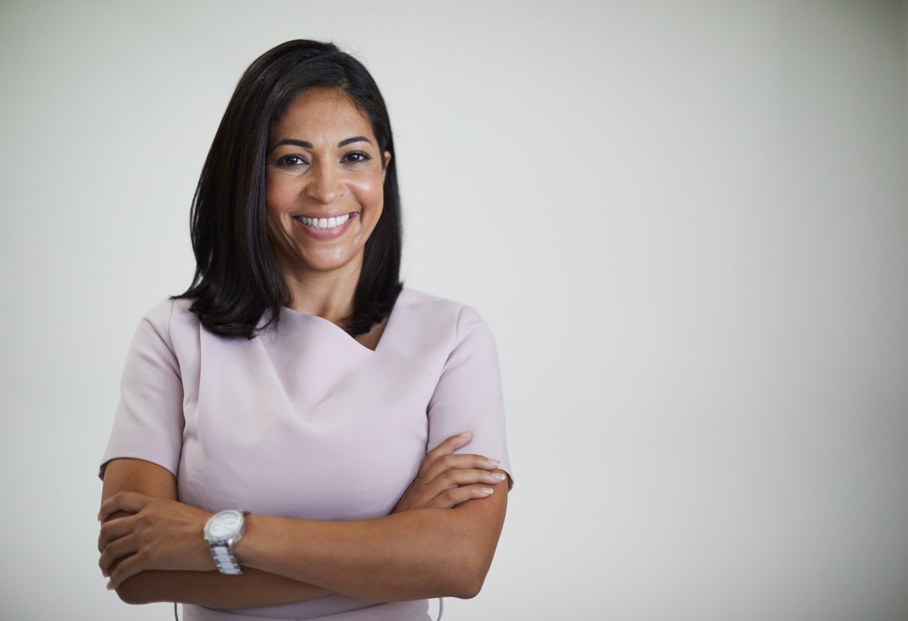 Studio headshot of beautiful Brazilian woman.